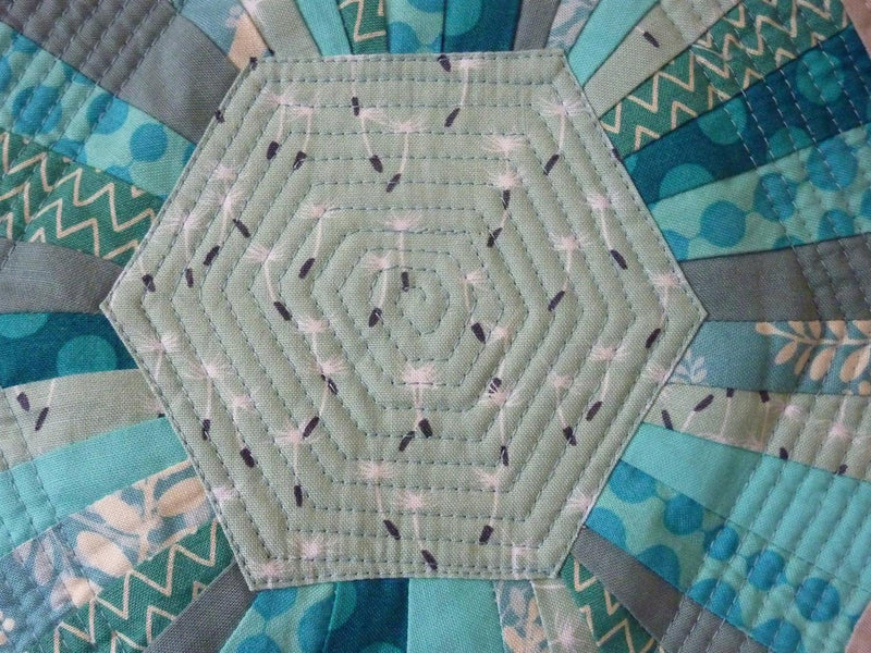 Hexa-scrappy quilt