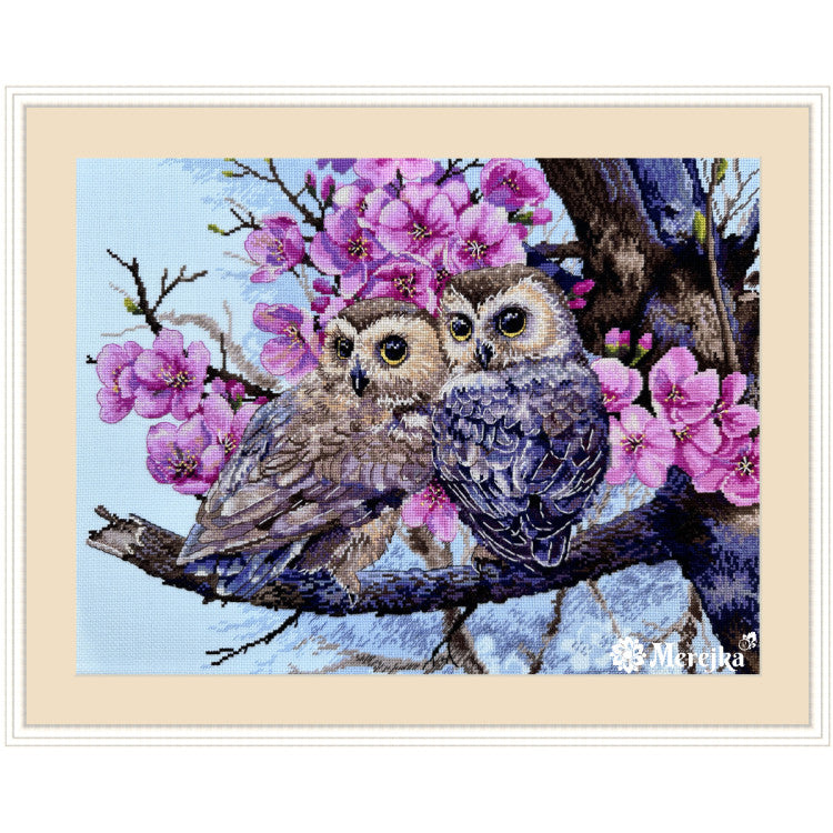 Merejka Two owls in spring blossom